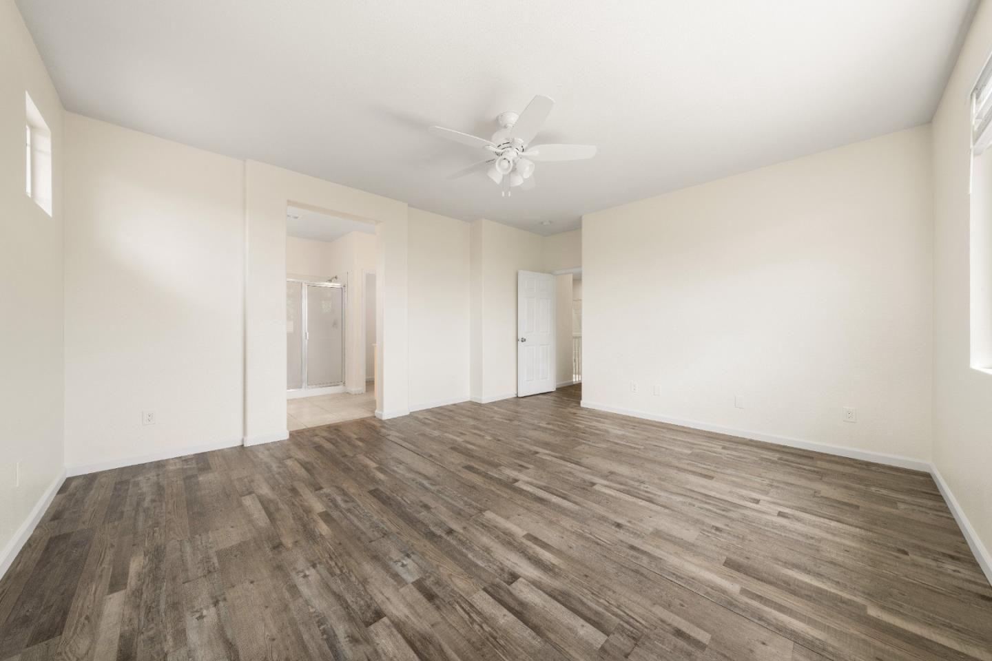 5700 Gold Poppy Way Elk Grove, CA 95757 - Photo 20 of 49 a view of empty room with wooden floor and ceiling fan