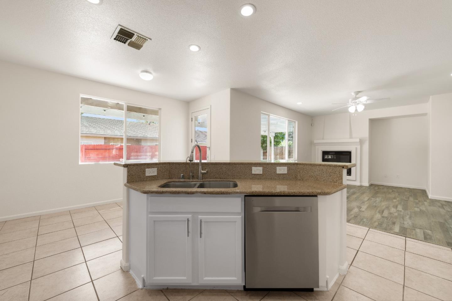 5700 Gold Poppy Way Elk Grove, CA 95757 - Photo 25 of 49 a kitchen with granite countertop a sink and a stove