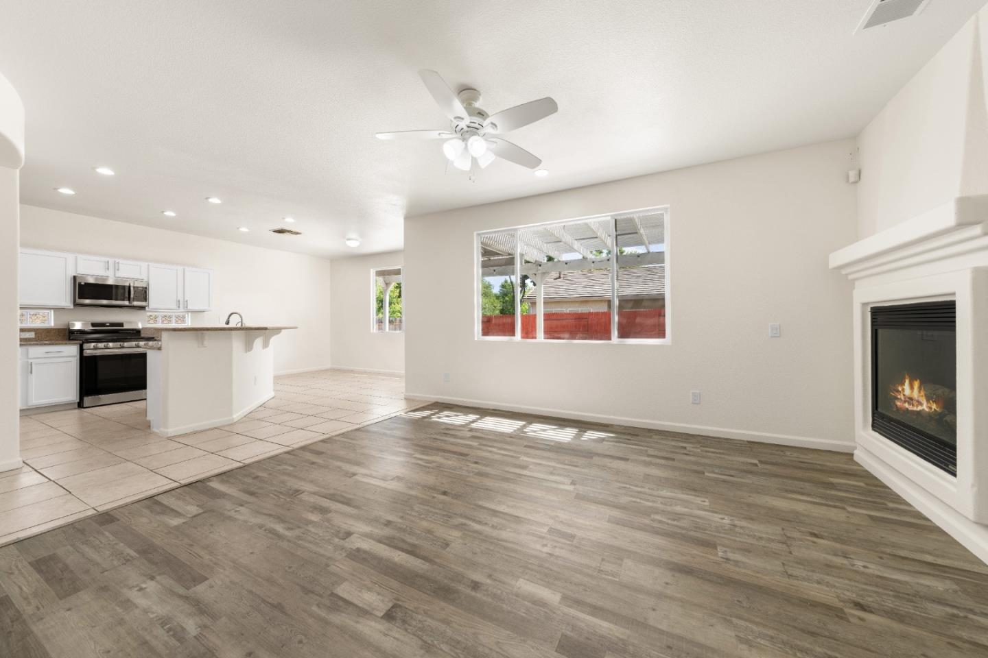 5700 Gold Poppy Way Elk Grove, CA 95757 - Photo 29 of 49 a view of an empty room with kitchen and a window