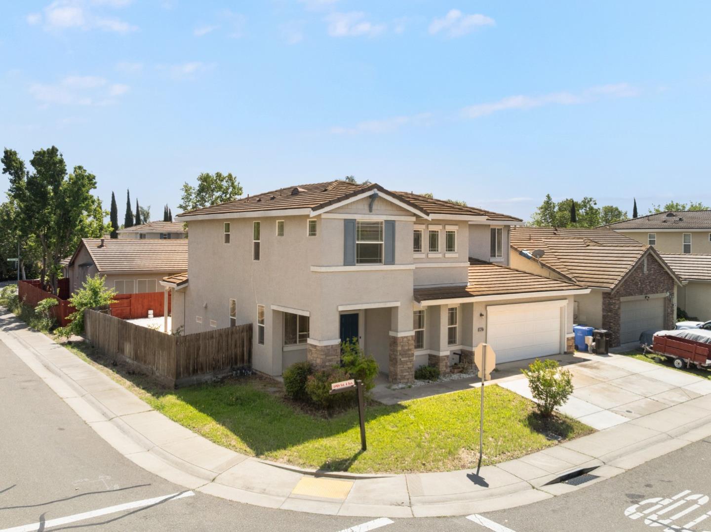 5700 Gold Poppy Way Elk Grove, CA 95757 - Photo 3 of 49 a front view of a house with a yard