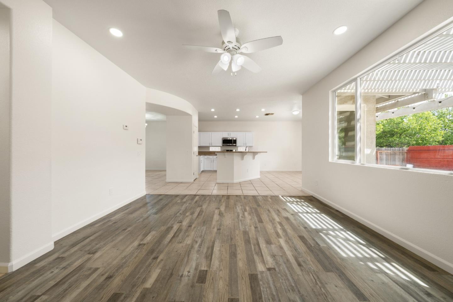 5700 Gold Poppy Way Elk Grove, CA 95757 - Photo 33 of 49 a view of empty room with wooden floor and fan