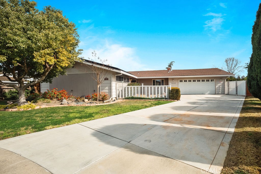 3046 El Capitan Avenue Merced, CA 95340 - Photo 2 of 18 a front view of a house with garden