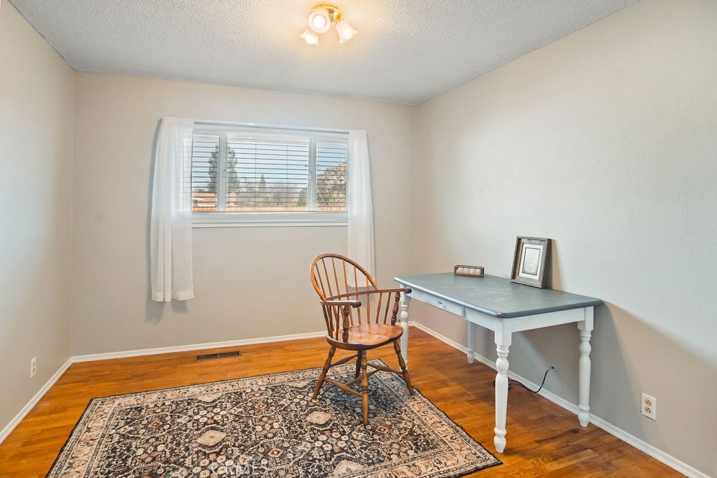 3046 El Capitan Avenue Merced, CA 95340 - Photo 8 of 18 a bedroom with a bed and a window