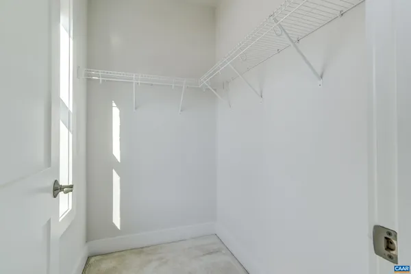 a bed room with furniture and a window