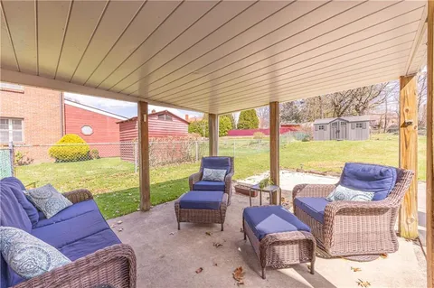 a outdoor living space with furniture and garden view