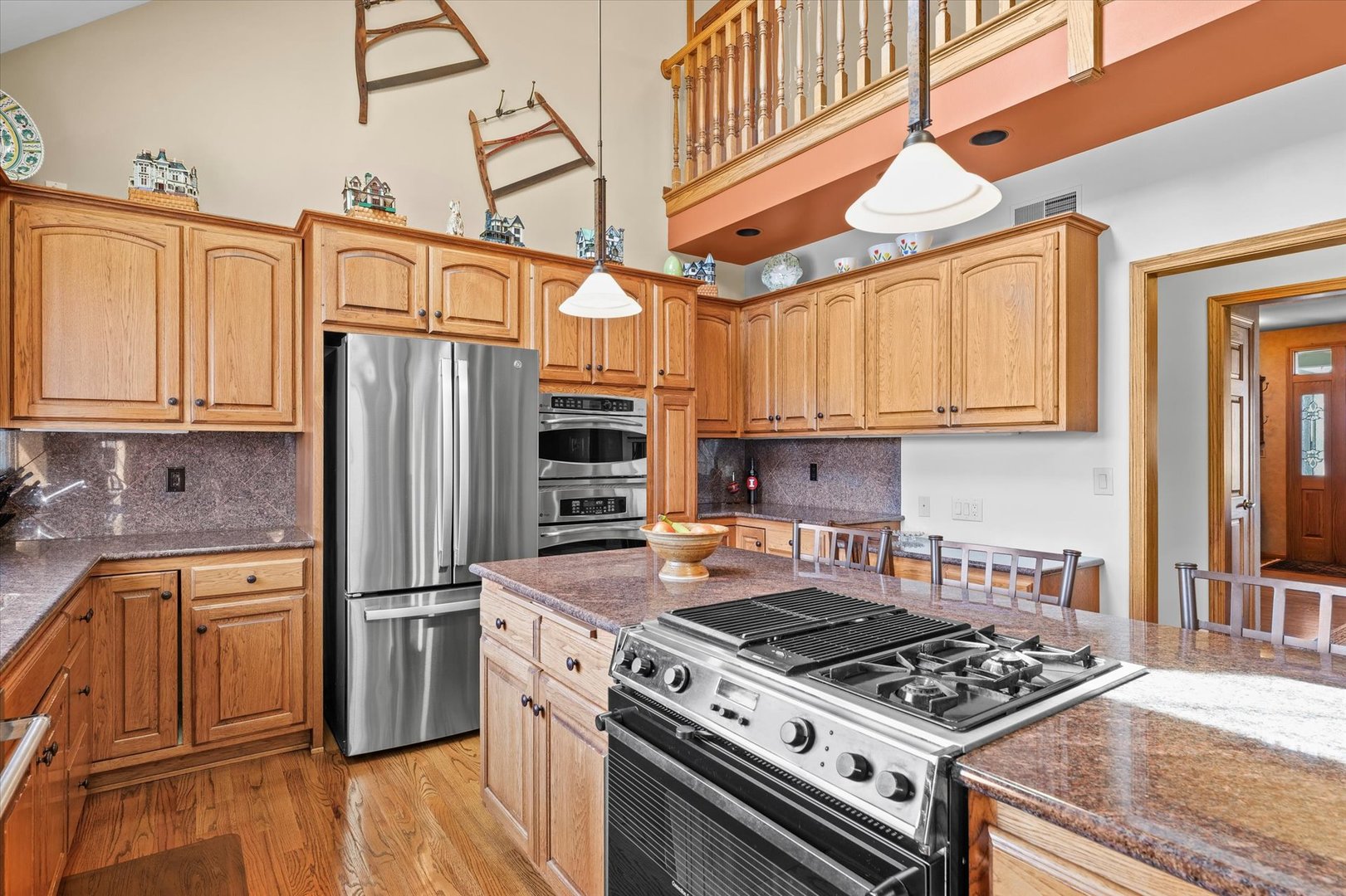 2204 Edgewater Place Champaign, IL 61822 - Photo 16 of 83 a kitchen with stainless steel appliances granite countertop a stove a refrigerator and a sink