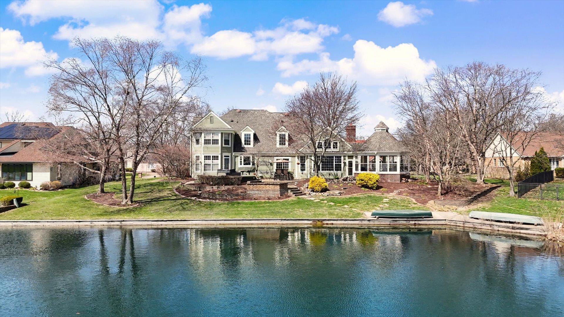2204 Edgewater Place Champaign, IL 61822 - Photo 4 of 83 a view of swimming pool with outdoor seating and lake view