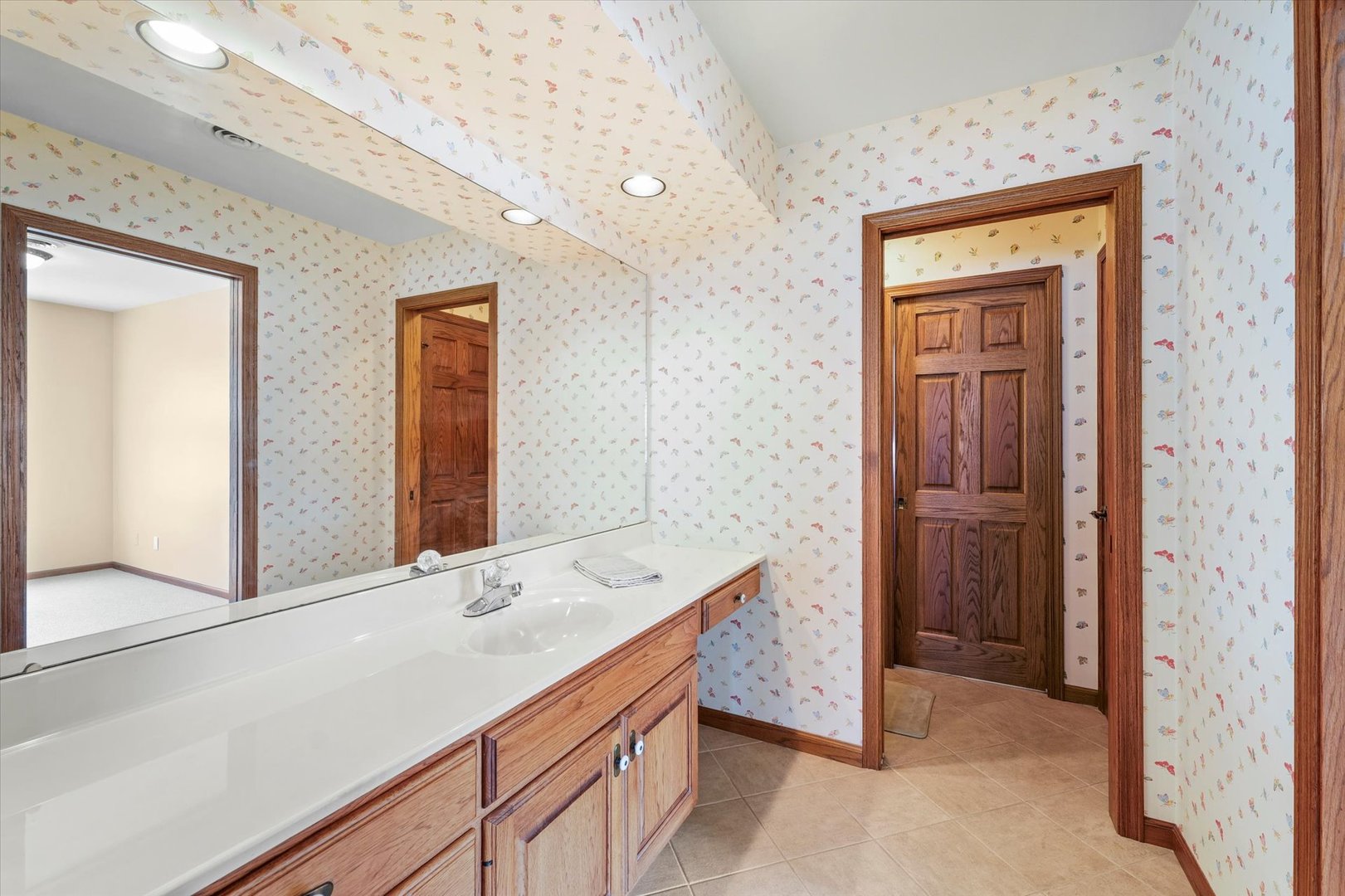 2204 Edgewater Place Champaign, IL 61822 - Photo 45 of 83 a bathroom with a sink and a mirror
