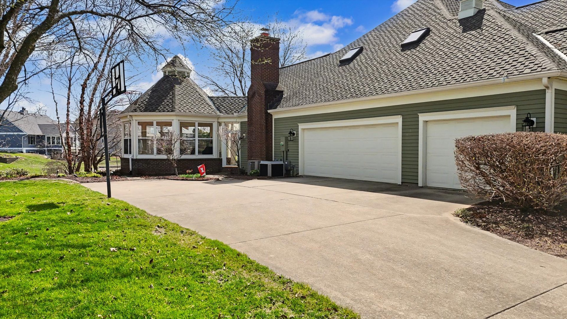 2204 Edgewater Place Champaign, IL 61822 - Photo 69 of 83 a front view of a house with a yard and garage