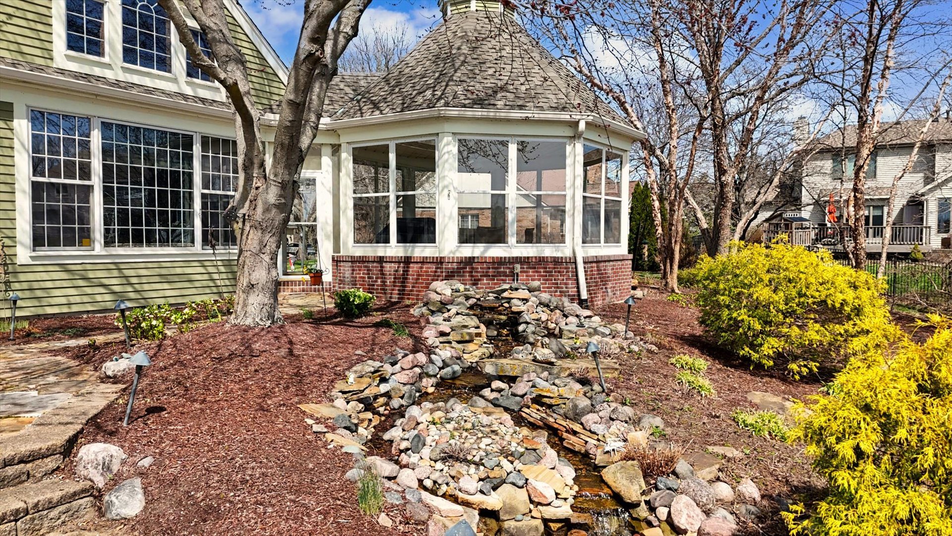 2204 Edgewater Place Champaign, IL 61822 - Photo 72 of 83 a front view of a house with a garden