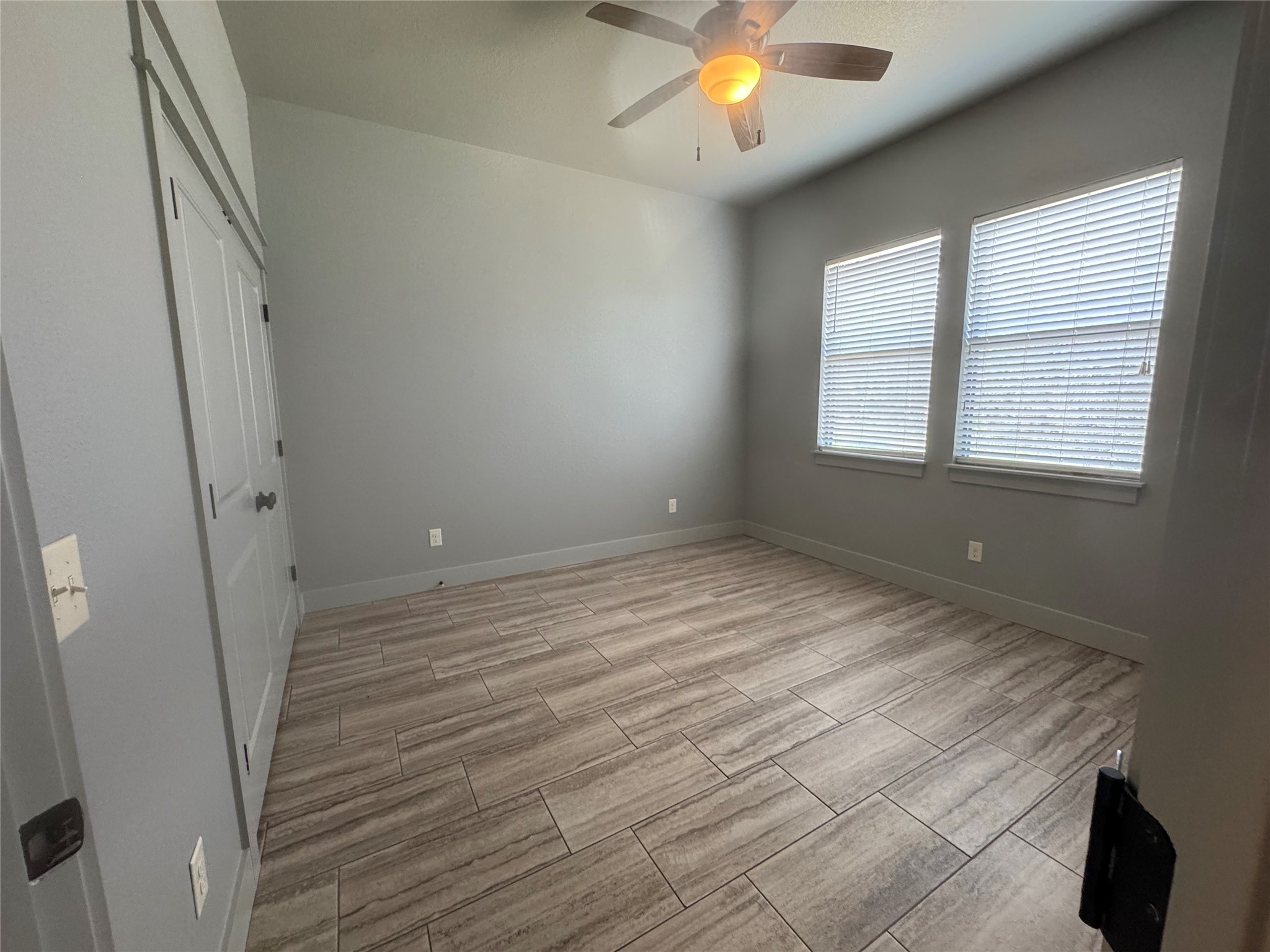 290 Hugo Road, Unit B San Marcos, TX 78666 - Photo 16 of 22 an empty room with windows