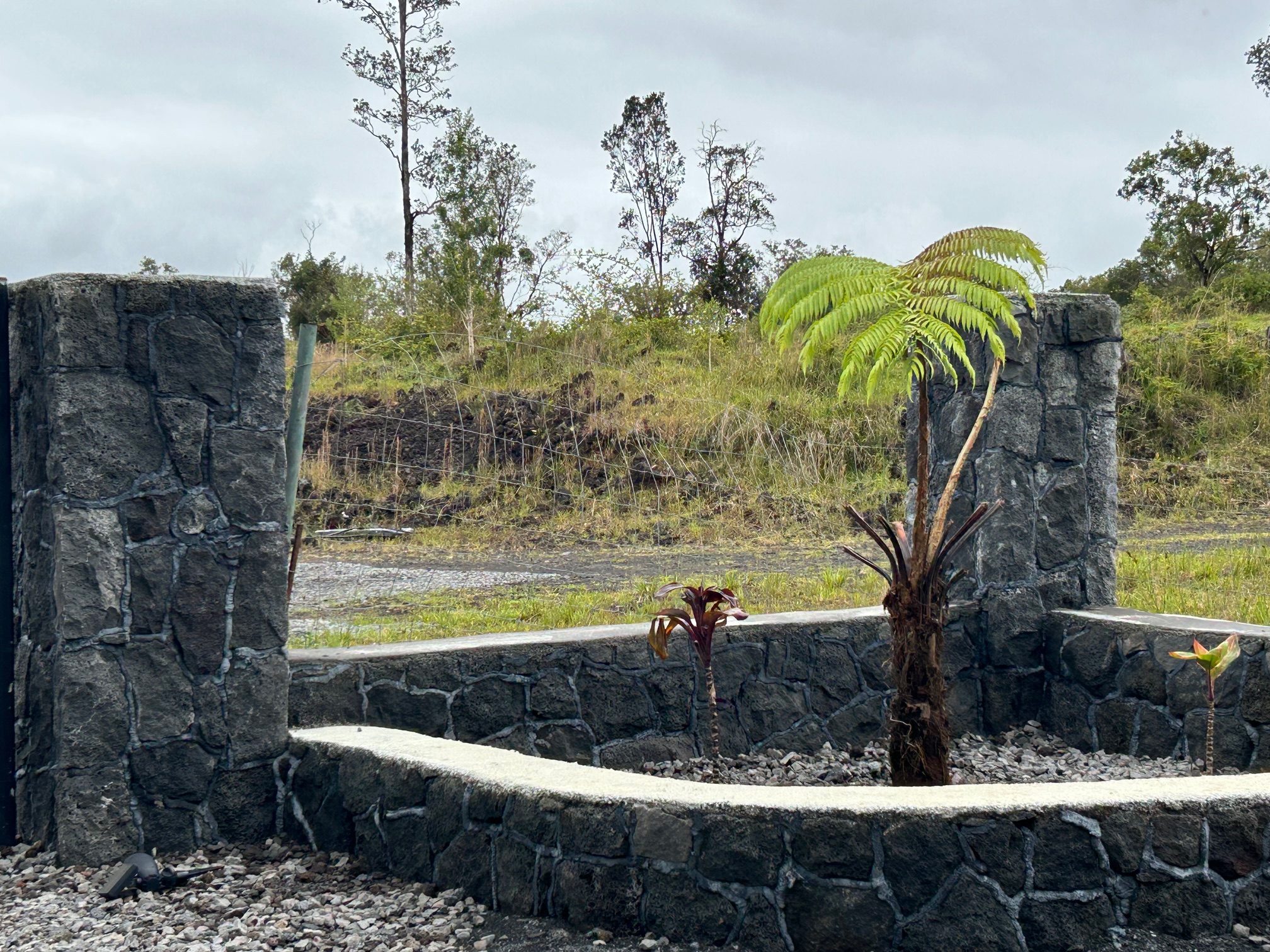 18-1309 Lot 10-d Ihope Rd Mountain View Mountain View, HI 96771 - Photo 17 of 17 a view of a water fountain in a backyard