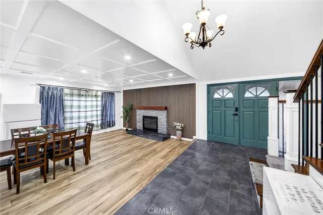 a view of a livingroom with furniture window and wooden floor