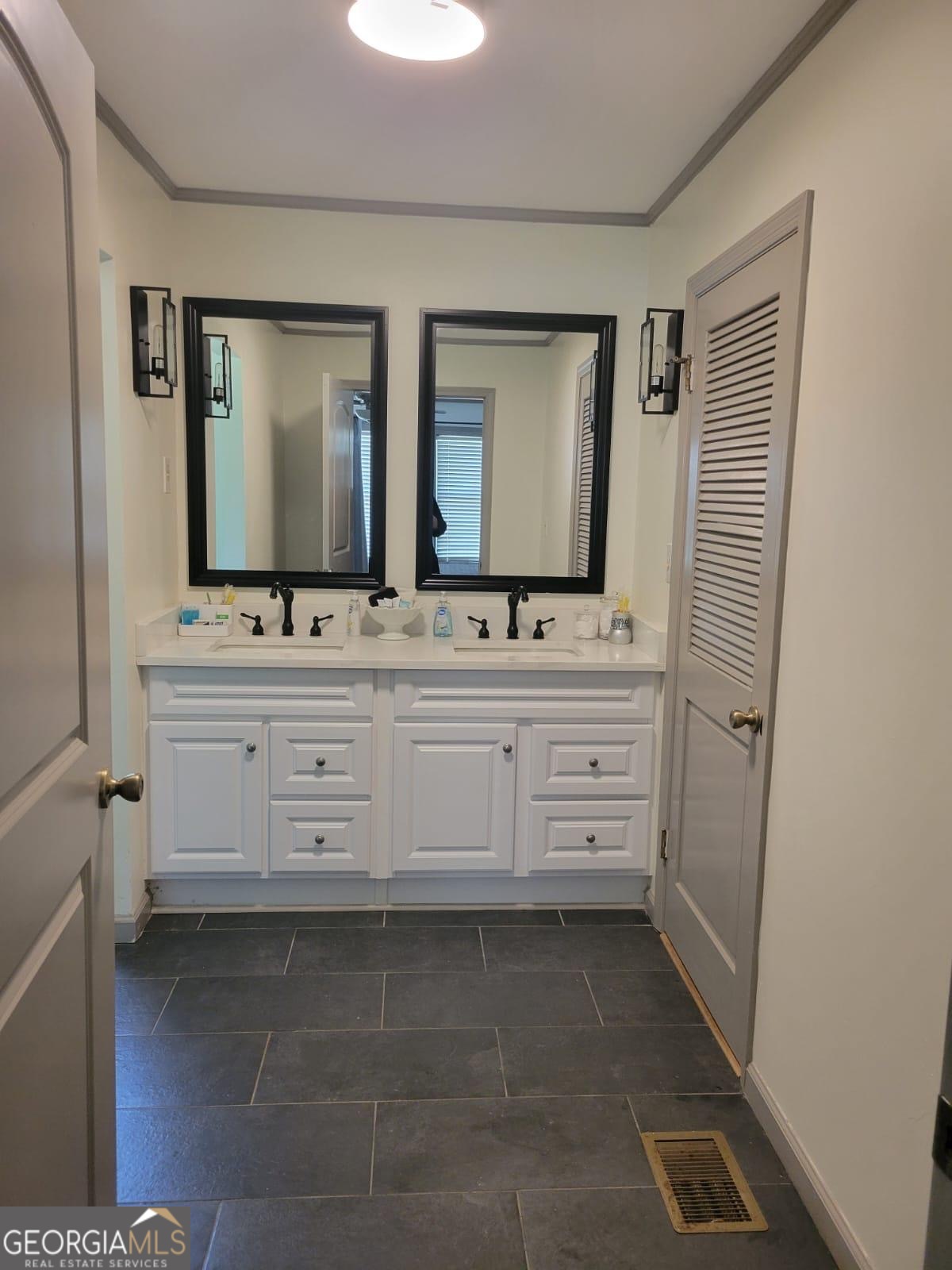 6127 Floyd Street Northeast Covington, GA 30014 - Photo 18 of 23 a bathroom with a sink and a mirror