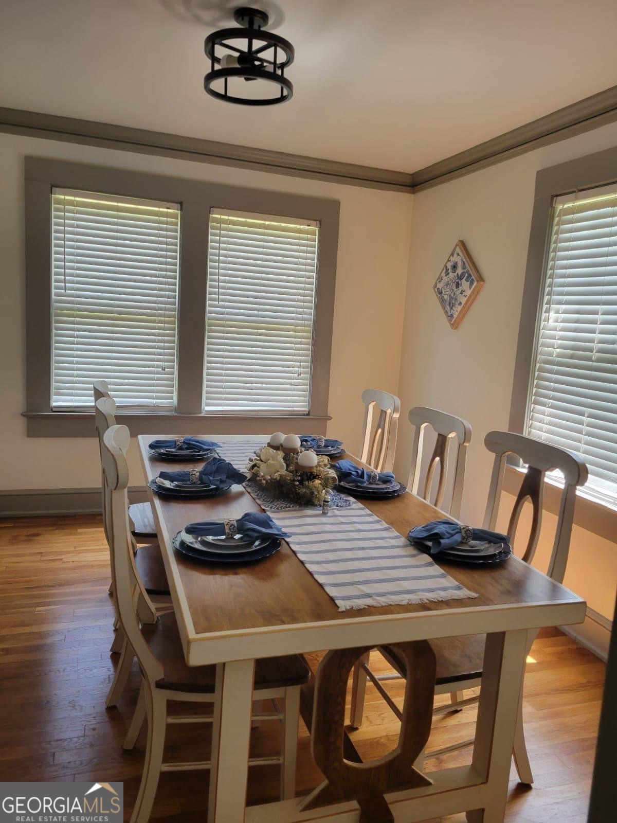 6127 Floyd Street Northeast Covington, GA 30014 - Photo 7 of 23 a view of a dining room with furniture and wooden floor