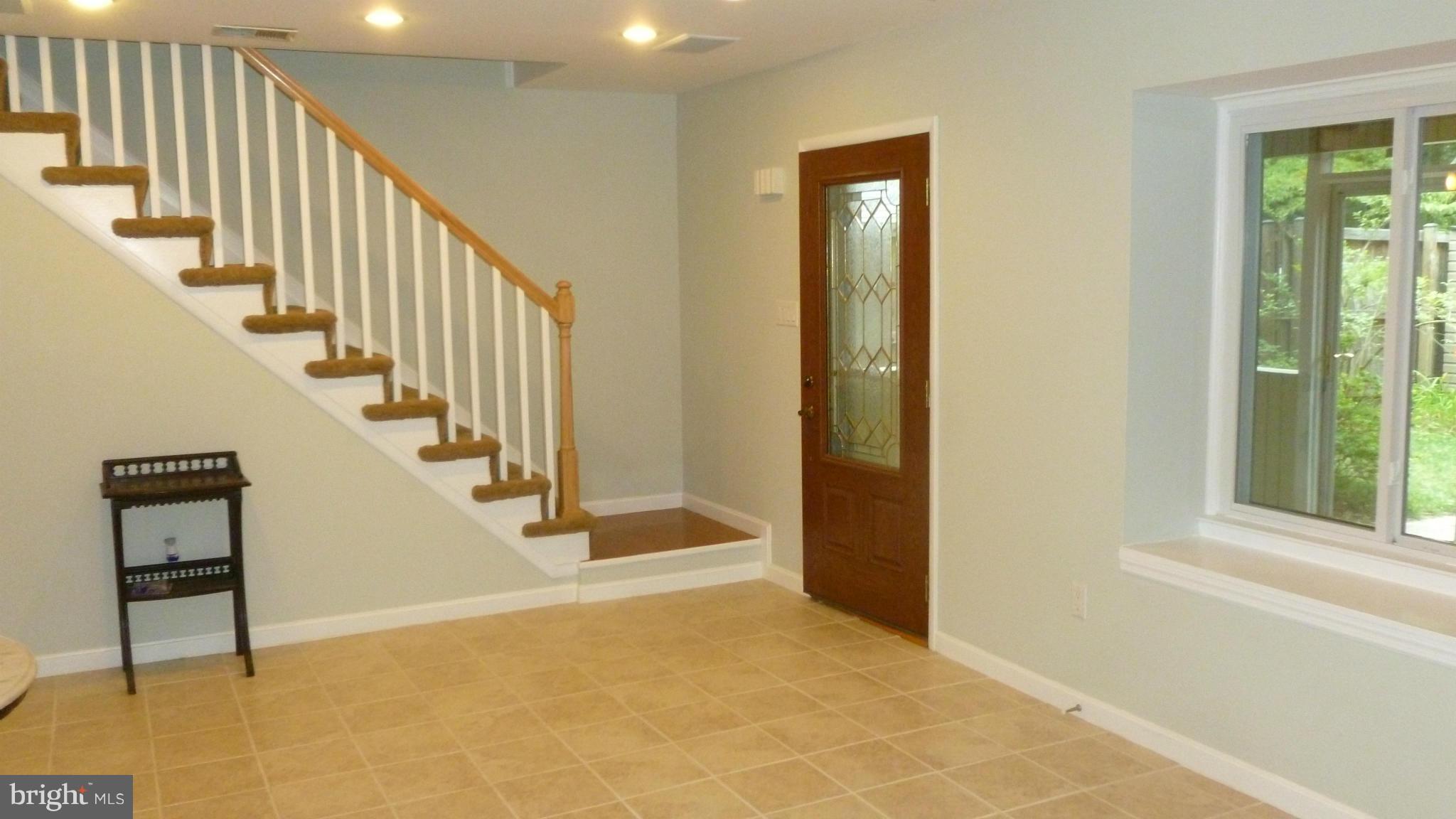 Living room with ceramic tile floors.
