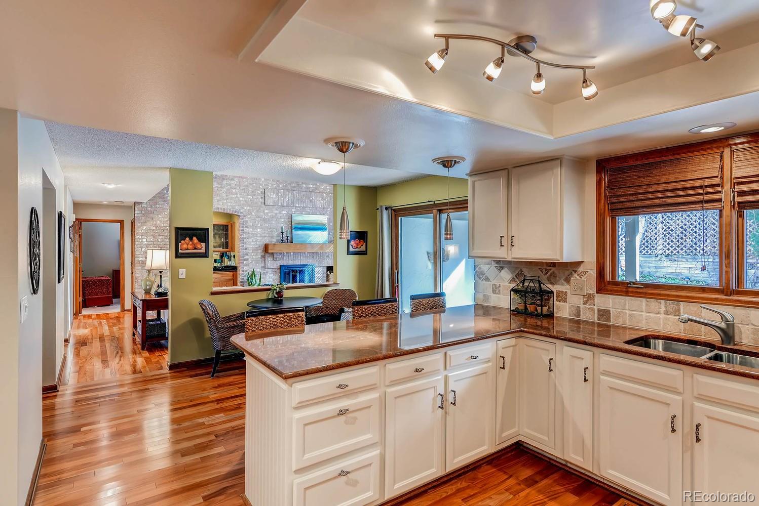 8110 Sweet Water Road Lone Tree, CO 80124 - Photo 17 of 34 a kitchen with granite countertop lots of counter top space