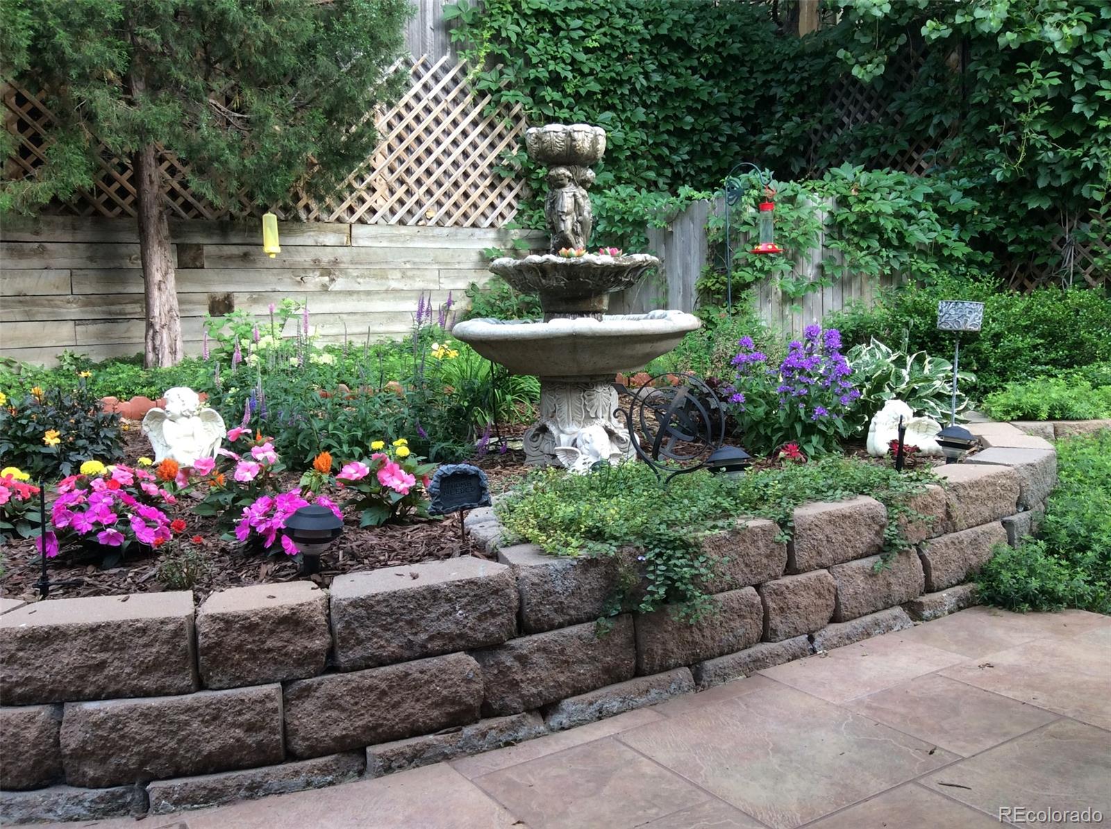 8110 Sweet Water Road Lone Tree, CO 80124 - Photo 28 of 34 a view of a garden with flowers