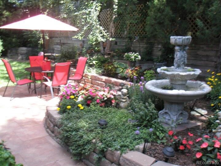8110 Sweet Water Road Lone Tree, CO 80124 - Photo 29 of 34 a view of a patio with table and chairs potted plants