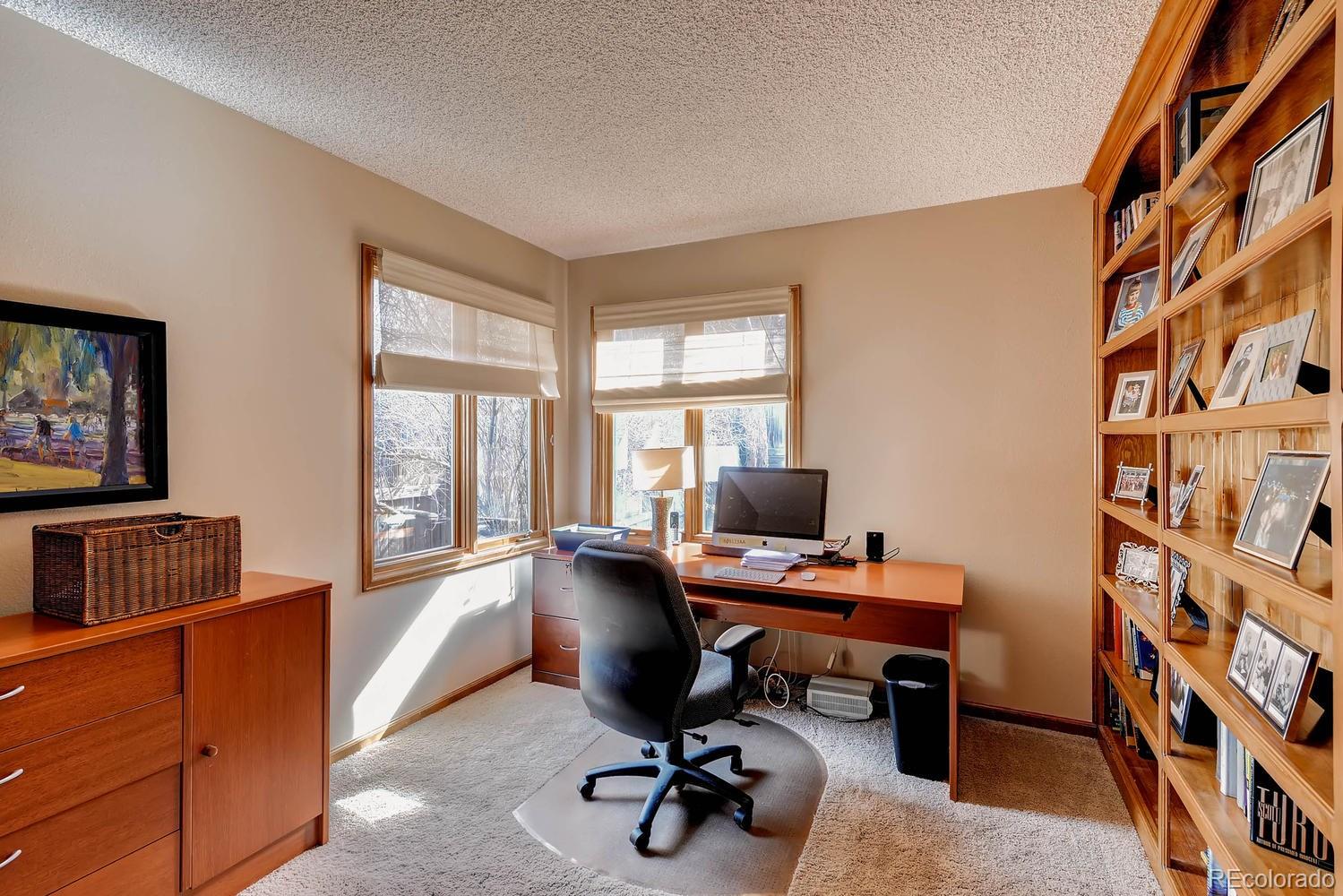 8110 Sweet Water Road Lone Tree, CO 80124 - Photo 9 of 34 a view of a workspace with furniture and a window