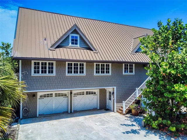 a front view of a house with a garage