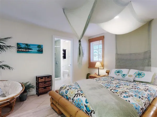 a bedroom with bed and window