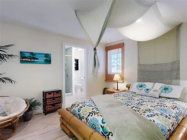 a bedroom with bed and window