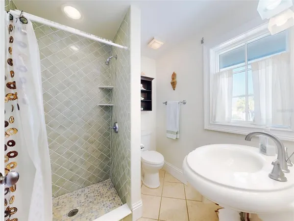 a bedroom with a bed and a view of bathroom