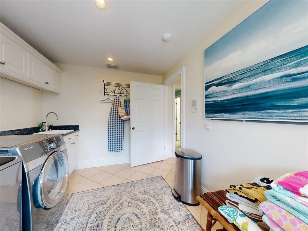 1913 Hill Street, Unit 2 New Smyrna Beach, FL 32169 - Photo 22 of 90 a view of a livingroom with washer and dryer