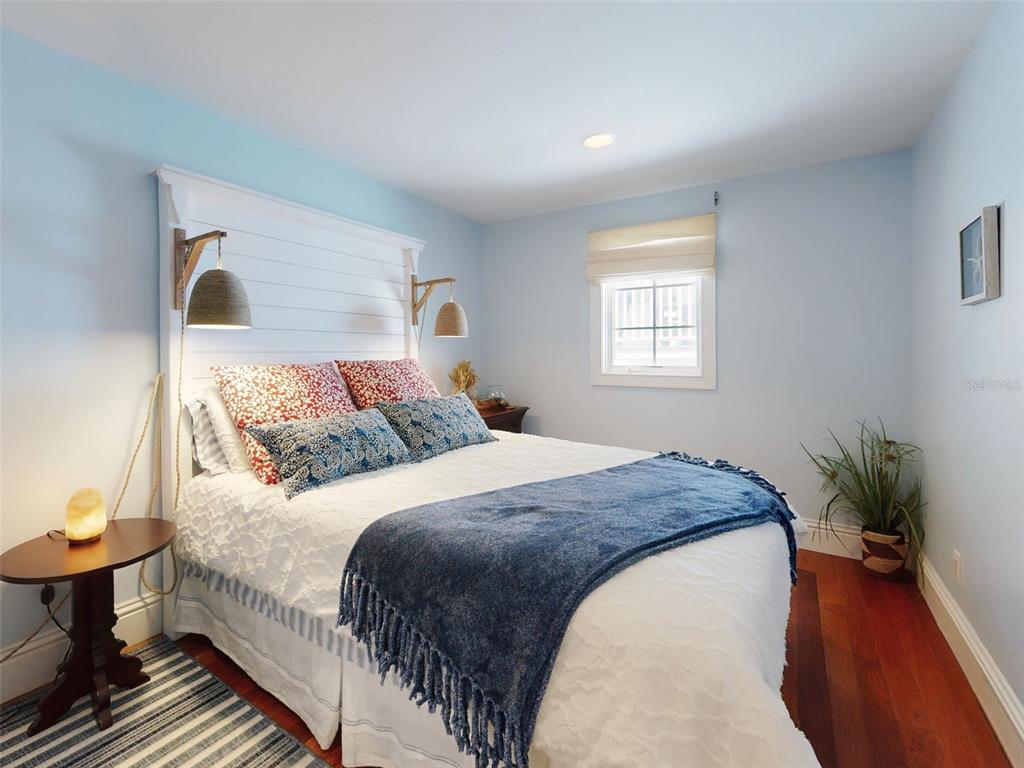 1913 Hill Street, Unit 2 New Smyrna Beach, FL 32169 - Photo 23 of 90 a bedroom with bed and window