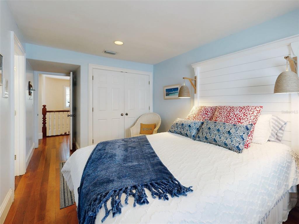 1913 Hill Street, Unit 2 New Smyrna Beach, FL 32169 - Photo 24 of 90 a bedroom with a bed and a view of bathroom