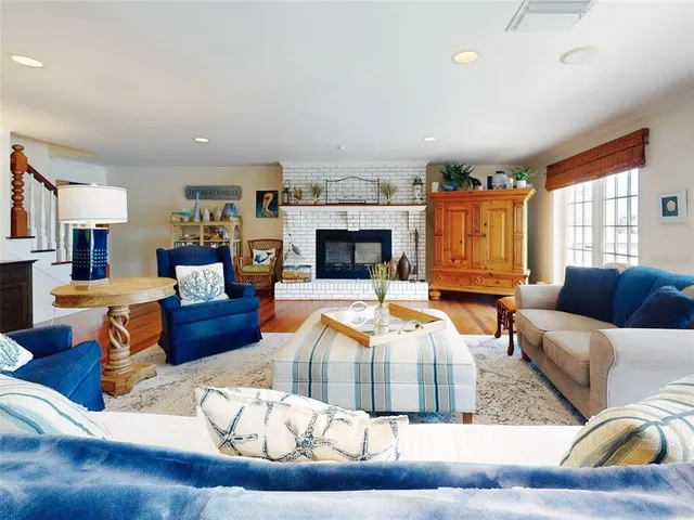 a dining room with furniture and a chandelier