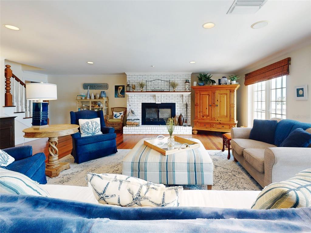 1913 Hill Street, Unit 2 New Smyrna Beach, FL 32169 - Photo 36 of 90 a living room with furniture fireplace and flat screen tv