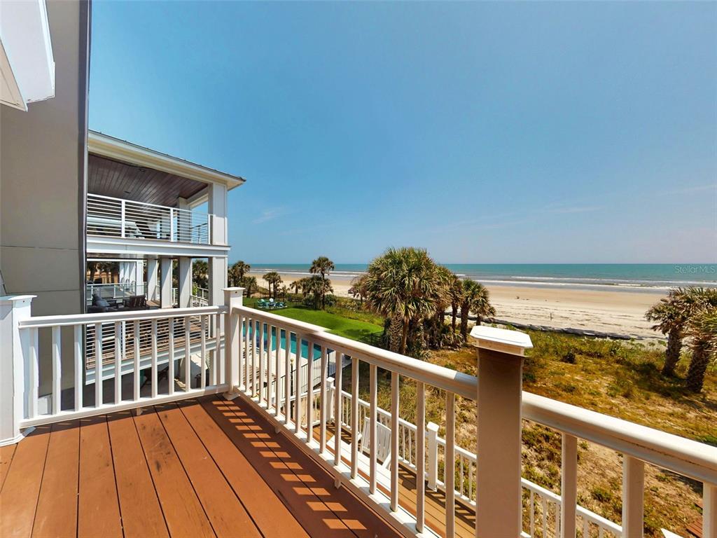 1913 Hill Street, Unit 2 New Smyrna Beach, FL 32169 - Photo 49 of 90 a view of a balcony with wooden floor and city view