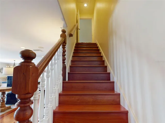 a balcony view with a seating space