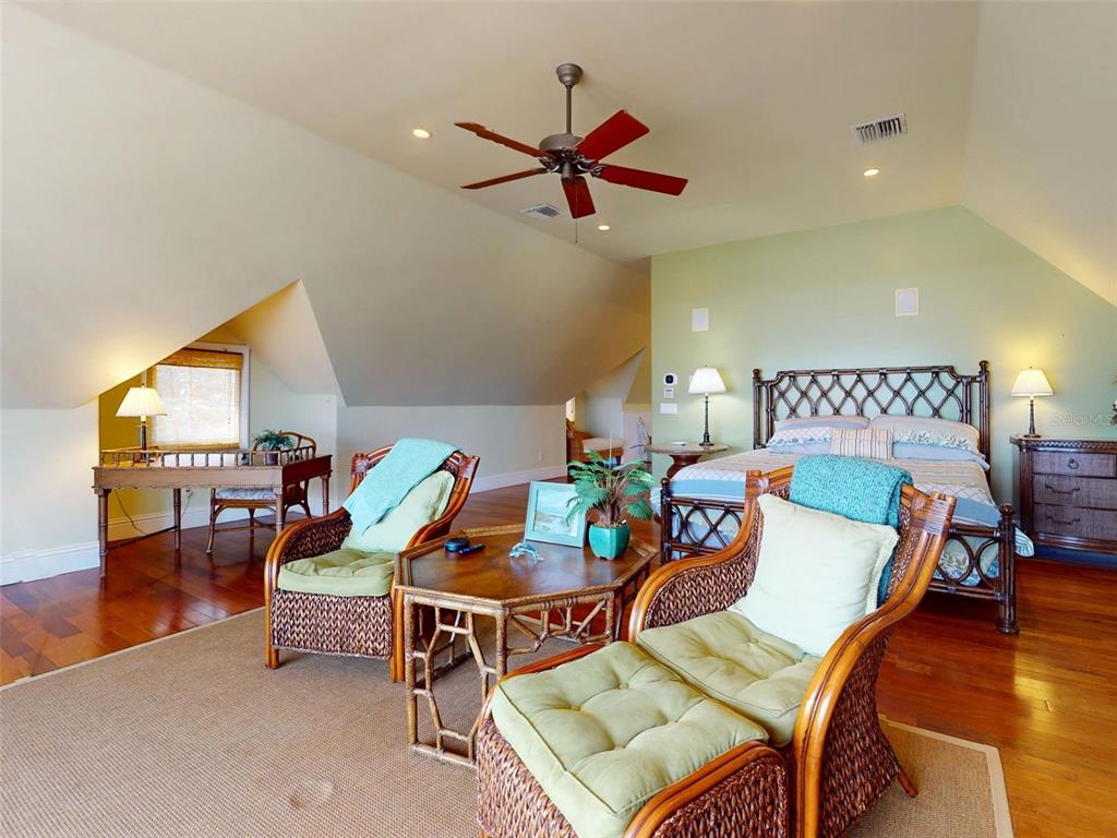 1913 Hill Street, Unit 2 New Smyrna Beach, FL 32169 - Photo 55 of 90 a living room with furniture and wooden floor