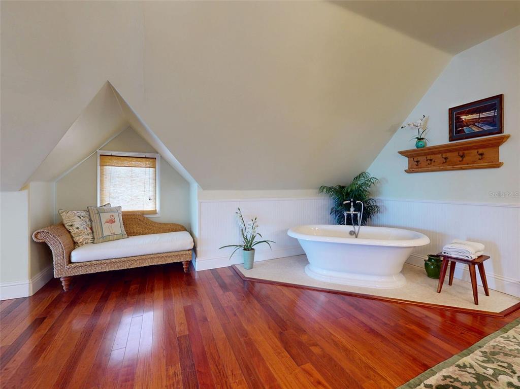 1913 Hill Street, Unit 2 New Smyrna Beach, FL 32169 - Photo 57 of 90 a living room with furniture and wooden floor