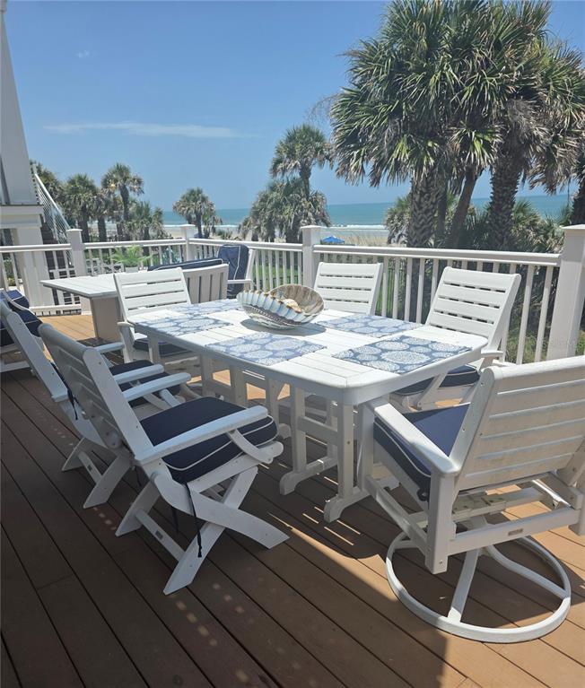1913 Hill Street, Unit 2 New Smyrna Beach, FL 32169 - Photo 80 of 90 a view of a balcony dining table and chairs