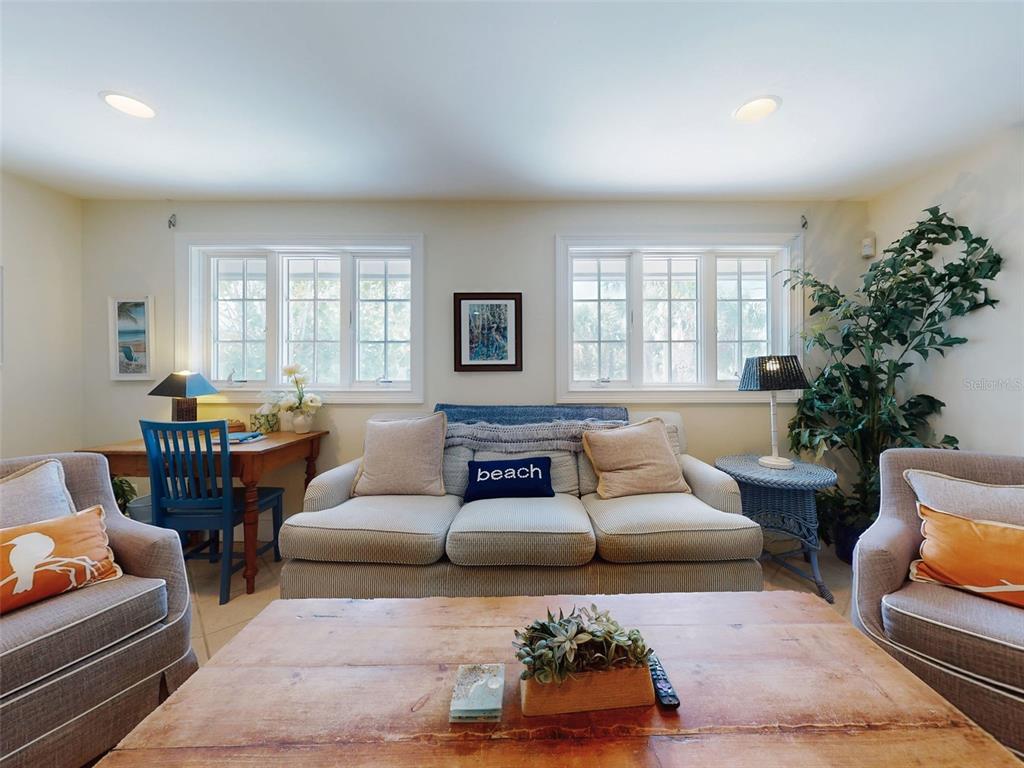 1913 Hill Street, Unit 2 New Smyrna Beach, FL 32169 - Photo 8 of 90 a living room with furniture and a potted plant