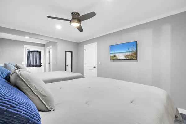 a large white bed in a white room