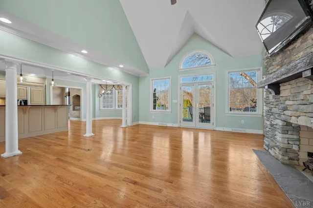 a kitchen with stainless steel appliances white cabinets and a refrigerator
