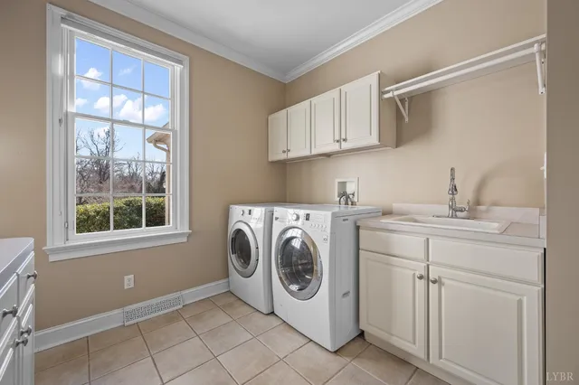 a view of a hallway with white walls and wooden floor