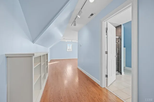 a view of a forest with mountains in the background