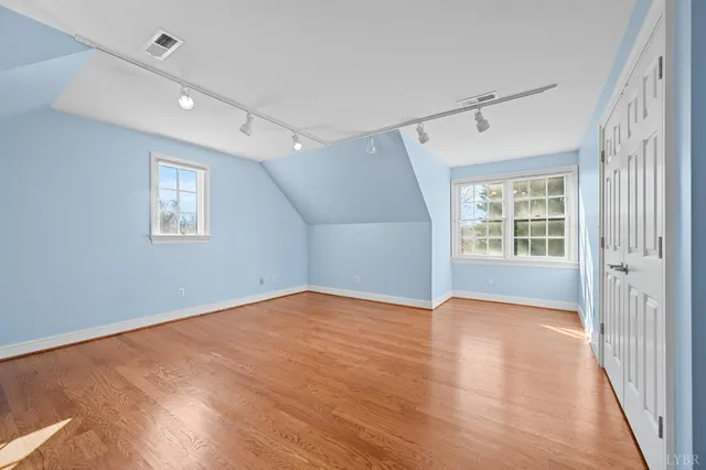 a view of a house with pool and sitting area