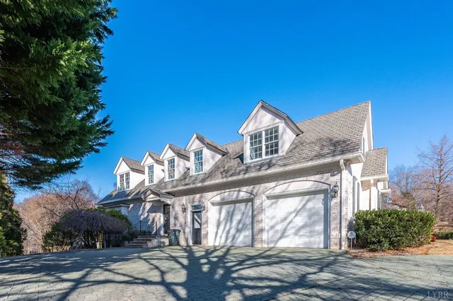 a view of empty room with wooden floor and fireplace