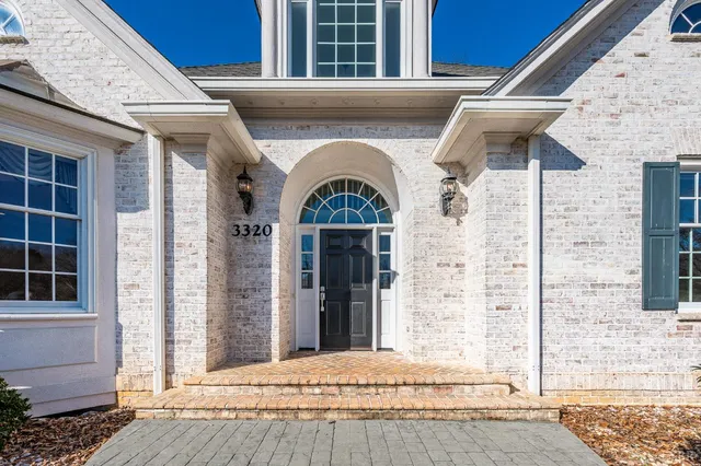 a view of kitchen with refrigerator and wooden floor