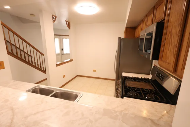 a view of an empty room and staircase