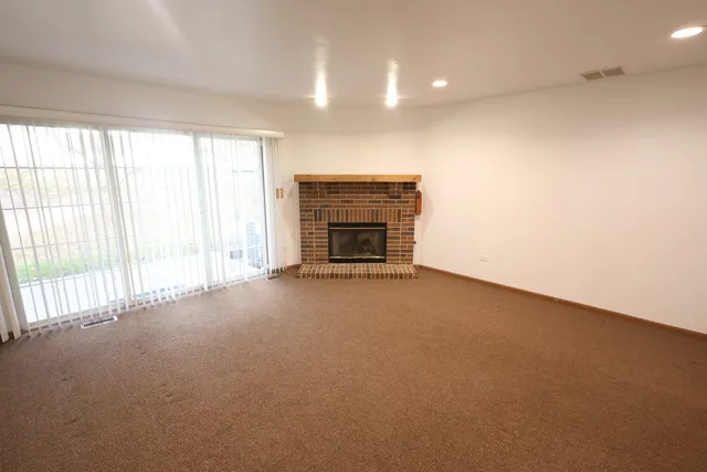 an empty room with fireplace