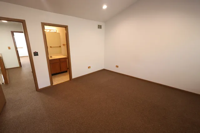 a bathroom with a sink mirror toilet and shower