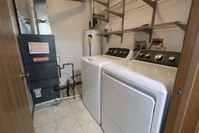 a view of a room with a ceiling fan